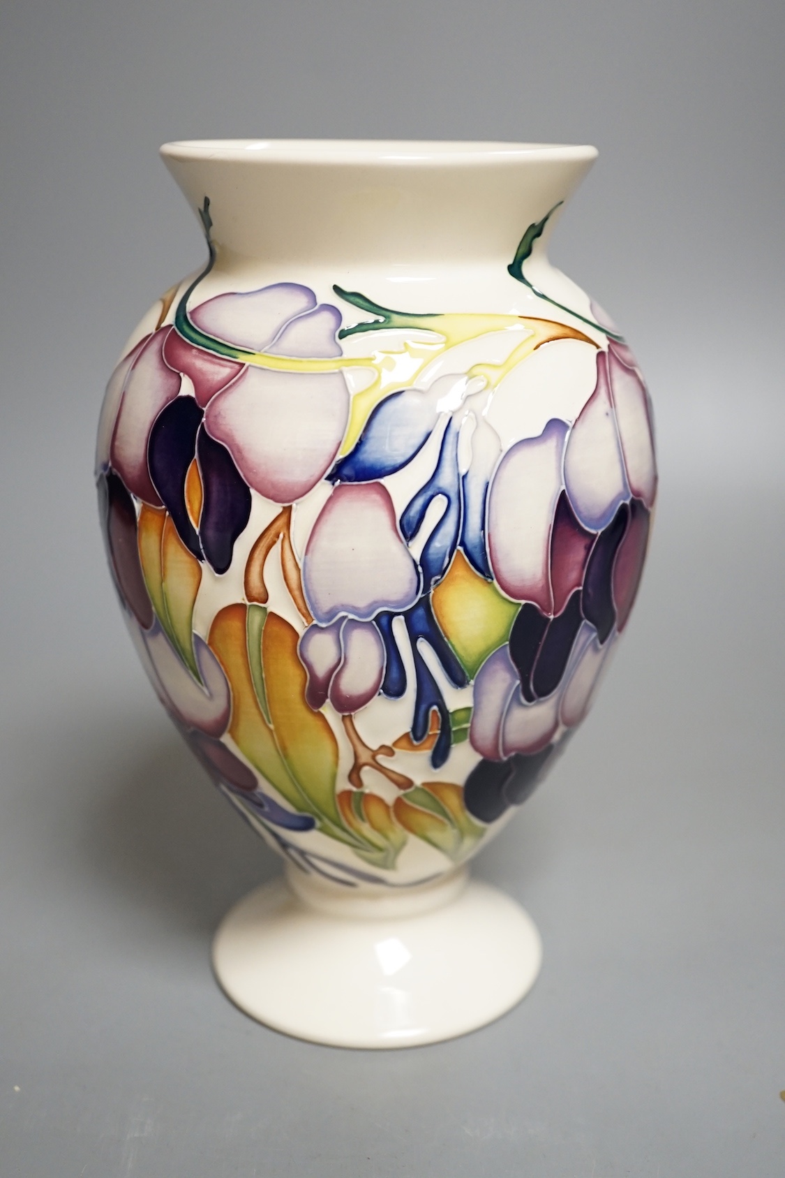 A Moorcroft 'purple wisteria' vase, 2013, 17.5 cms high.